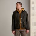 model wearing the Barbour Utility Spey Wax Jacket in Olive